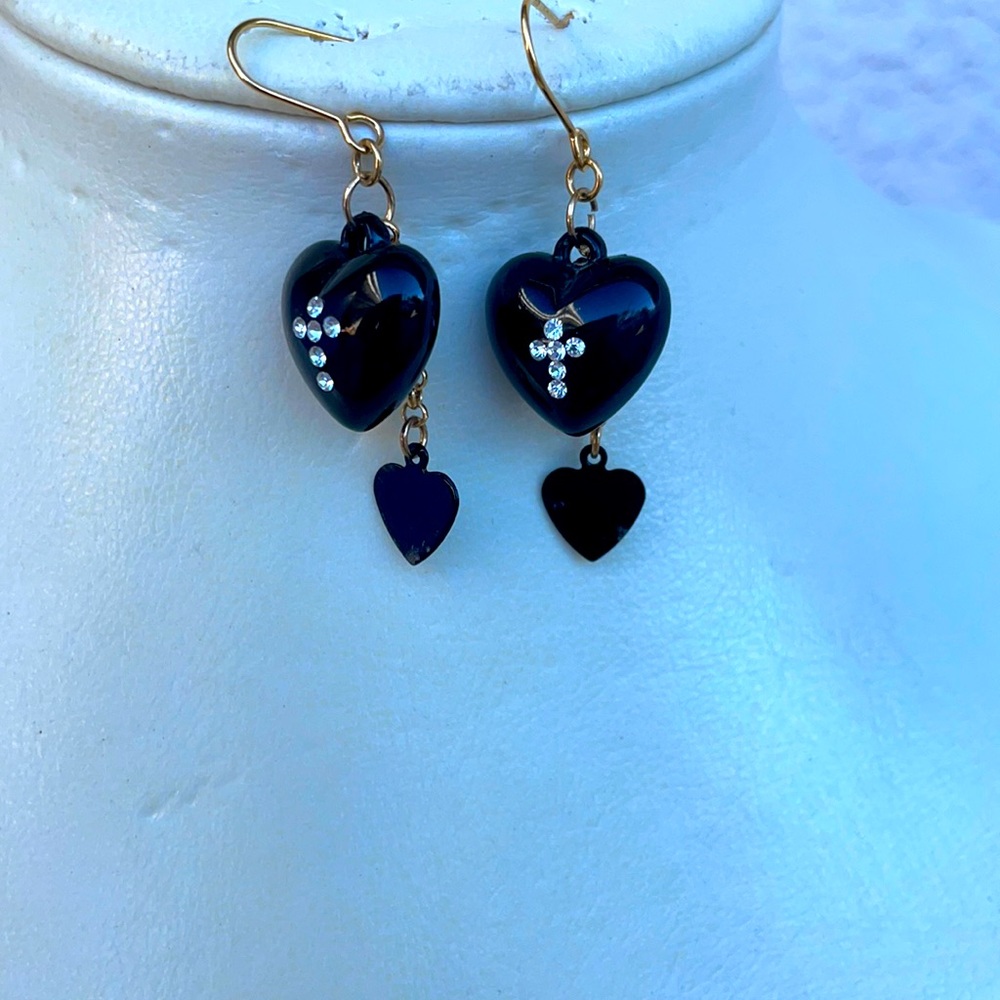 Black earrings and a ring